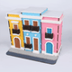Animación GIF de la maqueta de madera El Viejo San Juan, mostrando la transición visual desde la estructura de 76 piezas ensamblada en madera natural hasta su versión final completamente pintada con colores históricos.